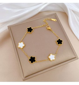BRACELET ACIER DORE FLEUR BLANC ET NOIR  22CM